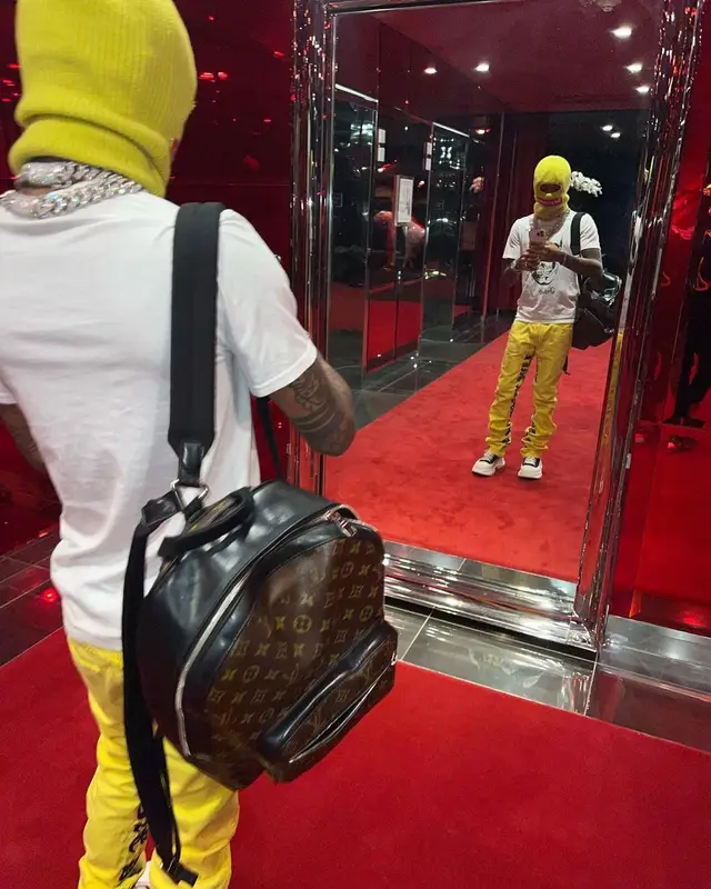 Swae Lee outfit in Louis Vuitton, Supreme, and New Era, 2022