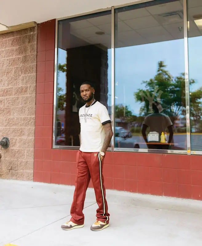 Shy Glizzy outfit in Wales Bonner, Nike, and Travis Scott Merch, 2022