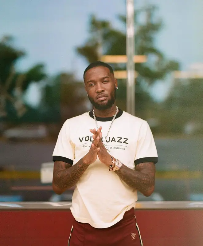 Shy Glizzy outfit in Wales Bonner, Nike, and Travis Scott Merch, 2022