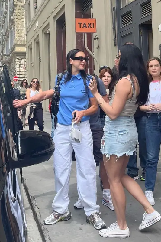 Dua Lipa outfit in Ralph Lauren, Balenciaga, and GCDS, 2022