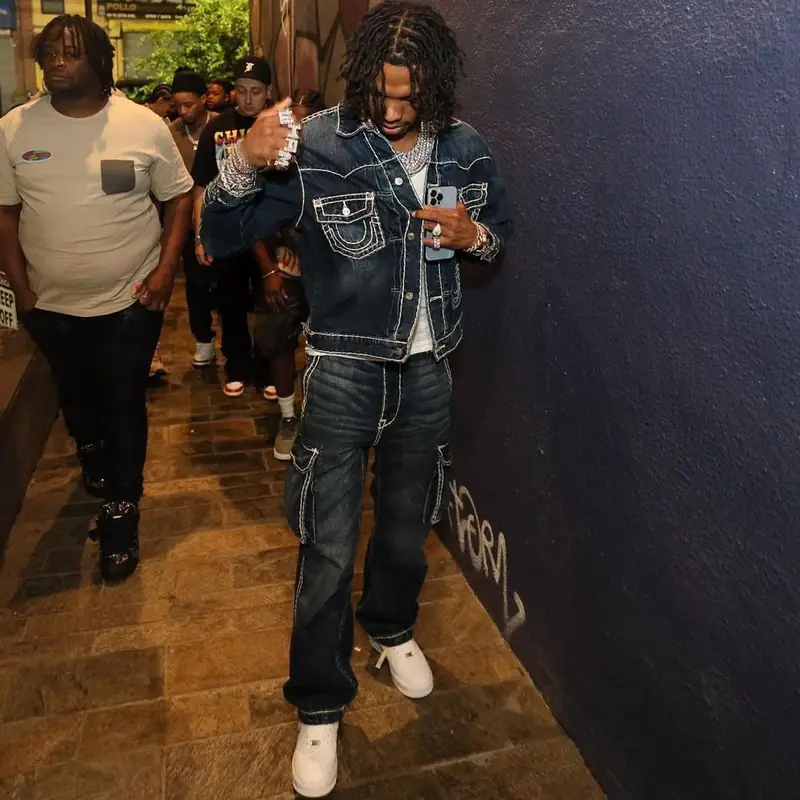 Lil Baby outfit in Supreme, Nike, and True Religion, 2022