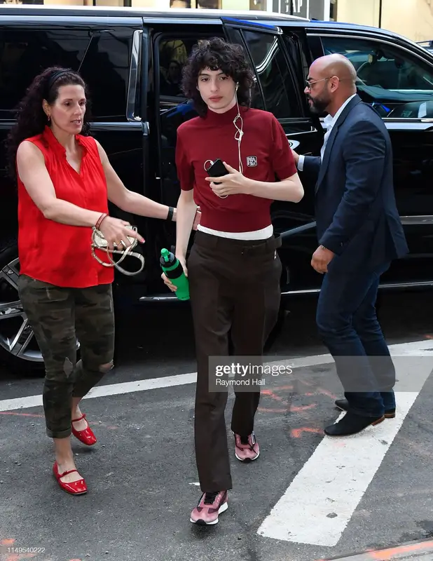 Finn Wolfhard outfit in Prada and Nomader, 2019