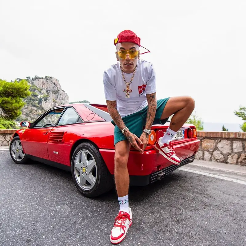 Sfera Ebbasta outfit in Casablanca, Louis Vuitton, and Ferrari, 2022