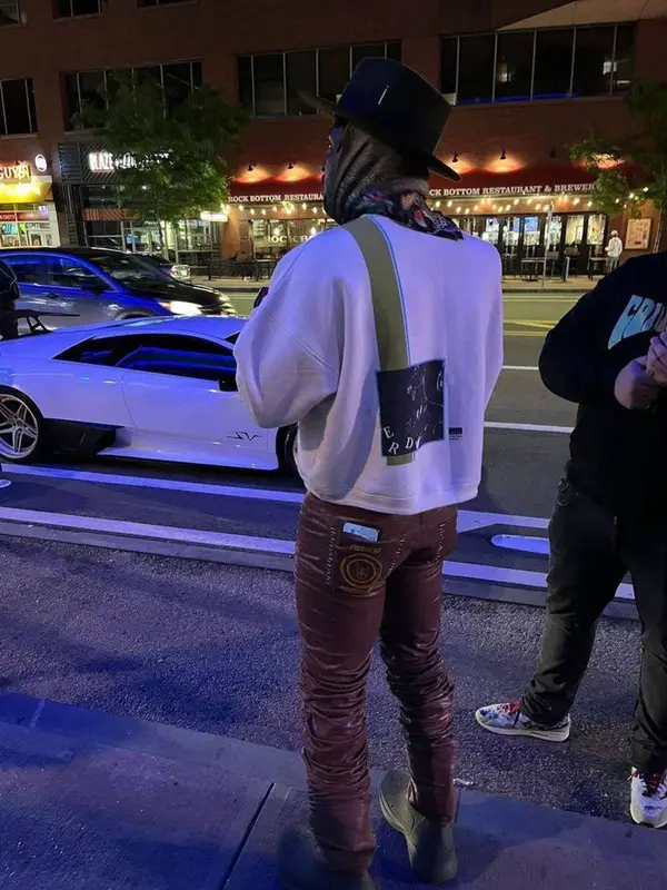 Antonio Brown outfit in Enfants Riches Deprimes, Marc Jacques Burton, and Amiri, 2022