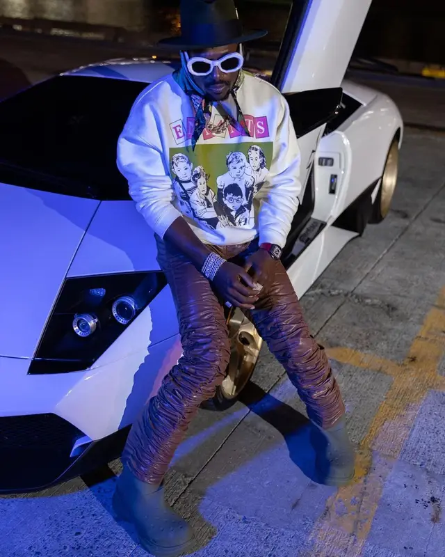 Antonio Brown outfit in Enfants Riches Deprimes, Marc Jacques Burton, and Amiri, 2022
