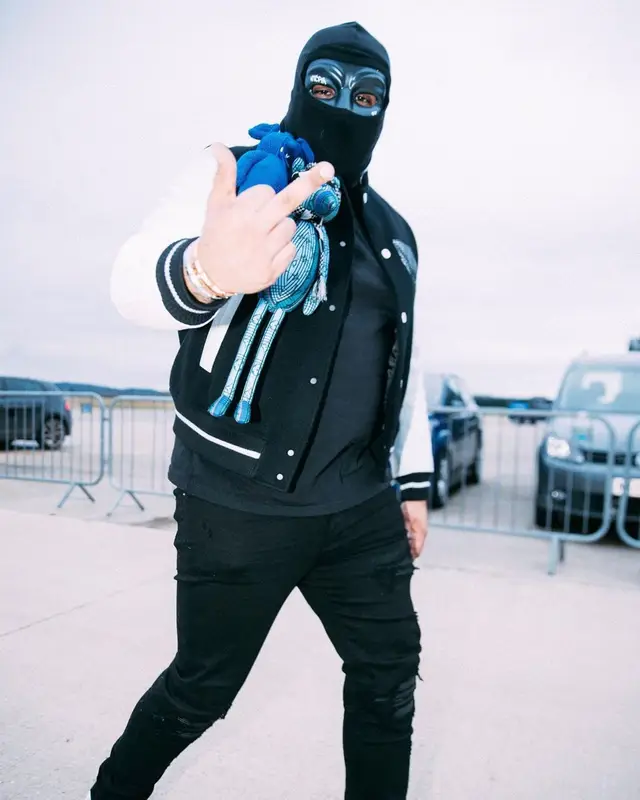 M Huncho outfit in Louis Vuitton, Amiri, and Nike, 2022