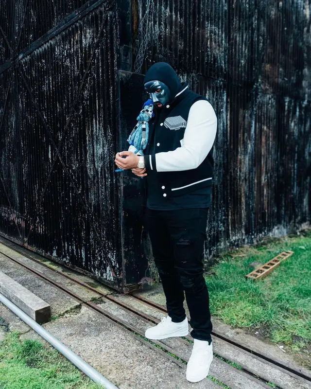 M Huncho outfit in Louis Vuitton, Amiri, and Nike, 2022