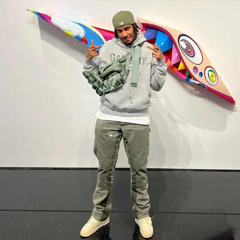 AJ Tracey outfit in Gallery Dept., Takashi Murakami, and Porter, 2022