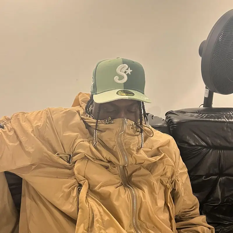 Lil Yachty outfit in New Era and Saintwoods, 2022