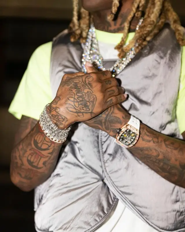 Lil Durk outfit in Rhude, Amiri, and Dior, 2022
