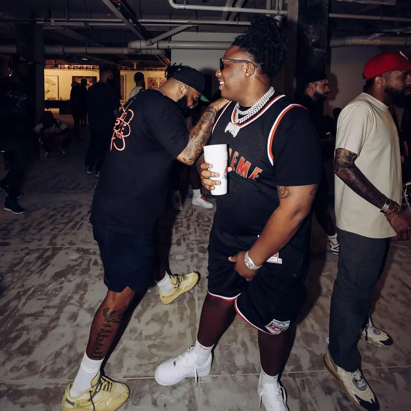 Tay Keith outfit in Supreme, Mitchell & Ness, and Hanes, 2022