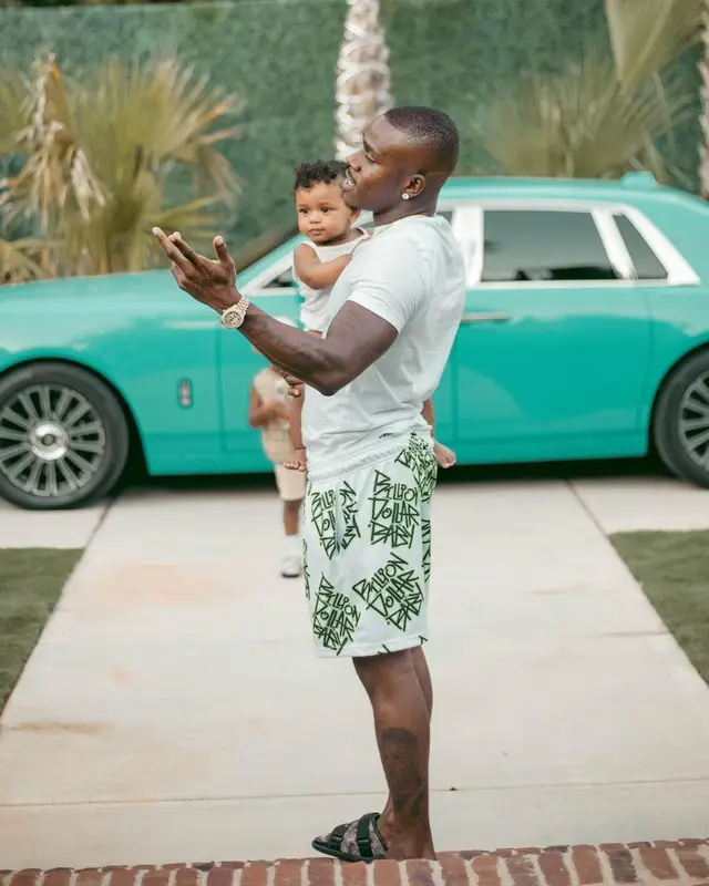 DaBaby outfit in Polo Ralph Lauren, Billion Dollar Baby, and Louis Vuitton, 2022