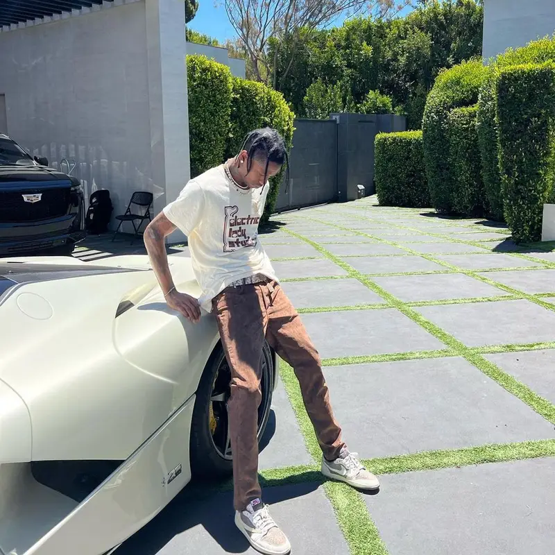 Travis Scott outfit in Cactus Jack, Travis Scott Merch, and Dior, 2022