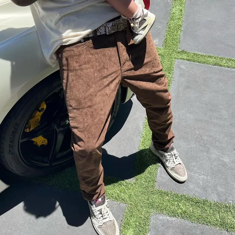Travis Scott outfit in Cactus Jack, Travis Scott Merch, and Dior, 2022
