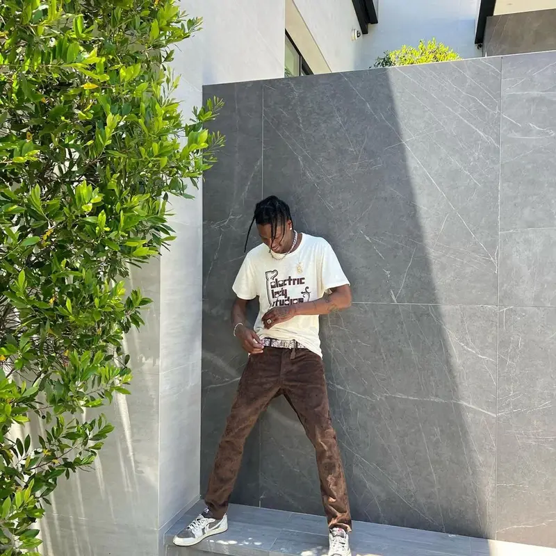 Travis Scott outfit in Cactus Jack, Travis Scott Merch, and Dior, 2022