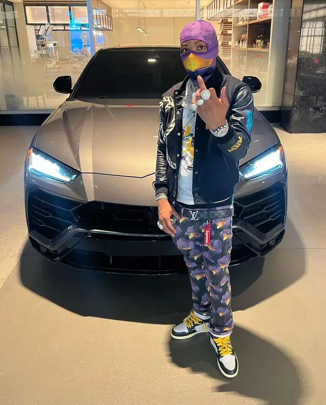 Lil Migo outfit in Kool Kiy, Louis Vuitton, and Roadrunners World Global, 2022