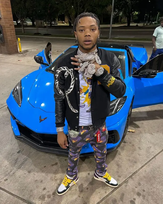 Lil Migo outfit in Kool Kiy, Louis Vuitton, and Roadrunners World Global, 2022