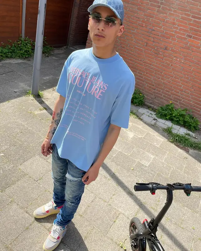 ADF Samski outfit in Versace, Ksubi, and Gucci, 2021