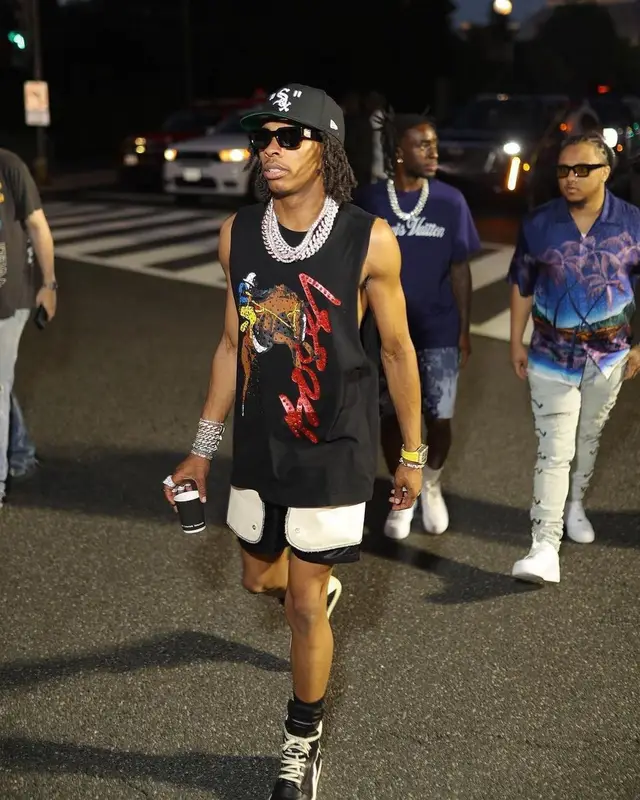 Lil Baby outfit in Louis Vuitton, New Era, and Off-White, 2022