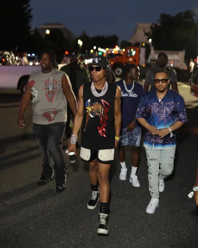 Lil Baby outfit in Louis Vuitton, New Era, and Off-White, 2022