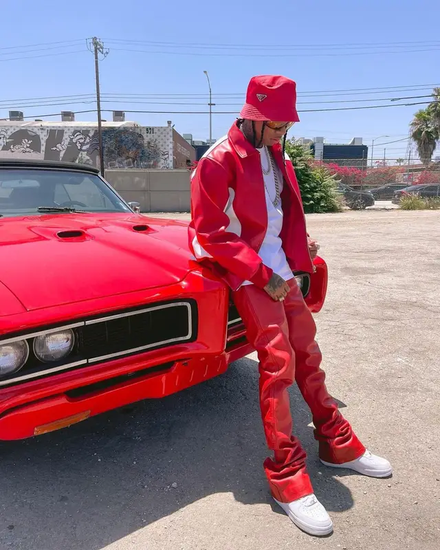 Tyga outfit in Nike, Tom Ford, and Prada, 2022