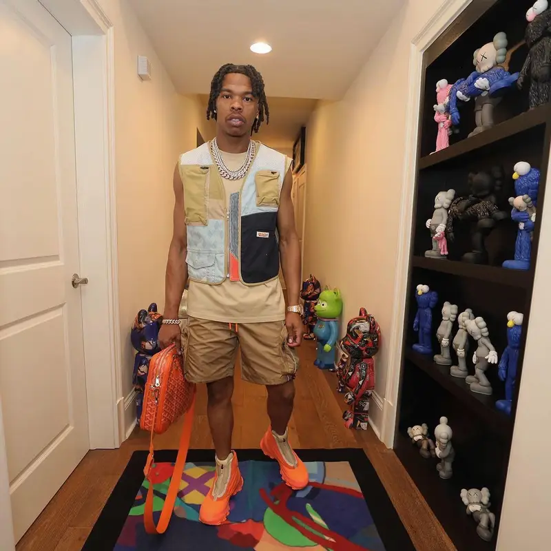 Lil Baby outfit in Louis Vuitton, Nike, and Goyard, 2022