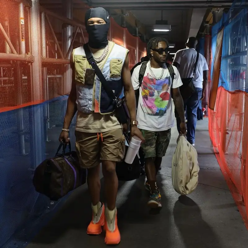 Lil Baby outfit in Louis Vuitton, Nike, and Goyard, 2022