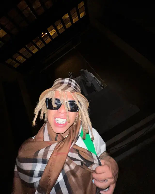 Iann Dior outfit in Bottega Veneta, Louis Vuitton, and Burberry, 2022