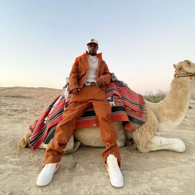 Bloody Osiris outfit in Louis Vuitton, Supreme, and New Era, 2022