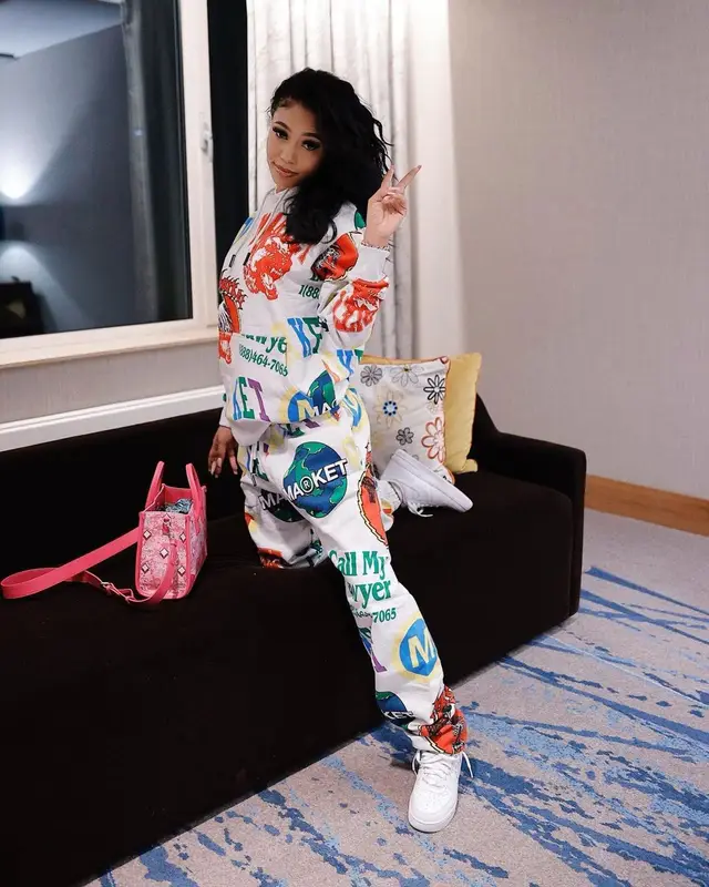 Coi Leray outfit in Market, Nike, and MCM, 2022