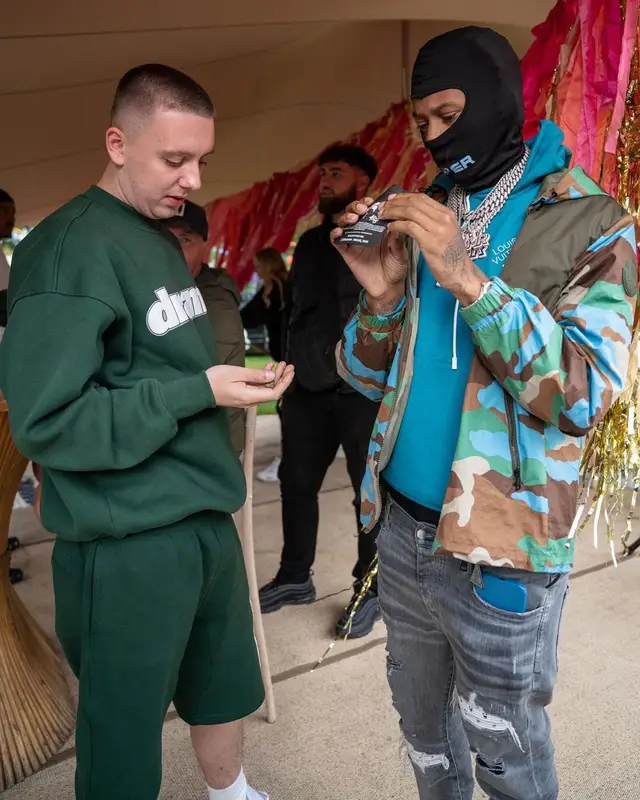 Digga D outfit in Moncler, Louis Vuitton, and Amiri, 2022