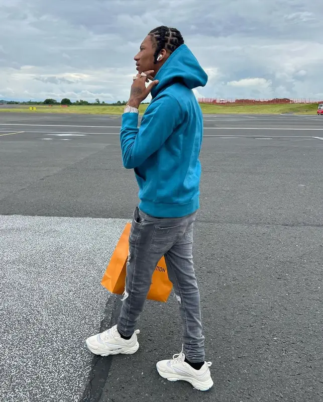 Digga D outfit in Moncler, Louis Vuitton, and Amiri, 2022