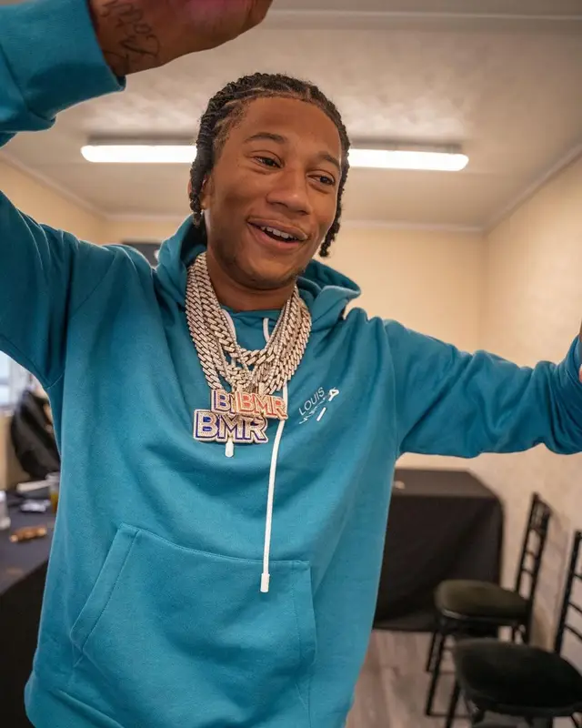 Digga D outfit in Moncler, Louis Vuitton, and Amiri, 2022
