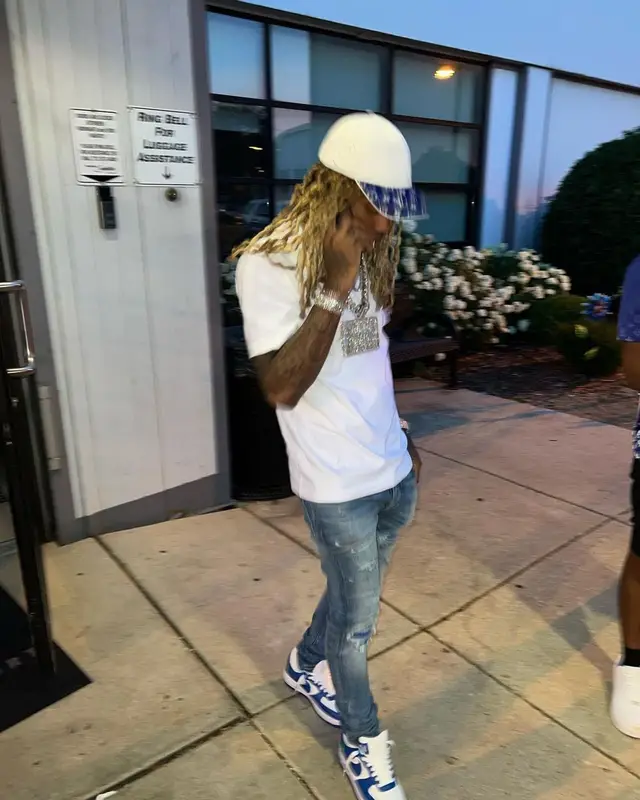Lil Durk outfit in Amiri, Nike, and Louis Vuitton, 2022