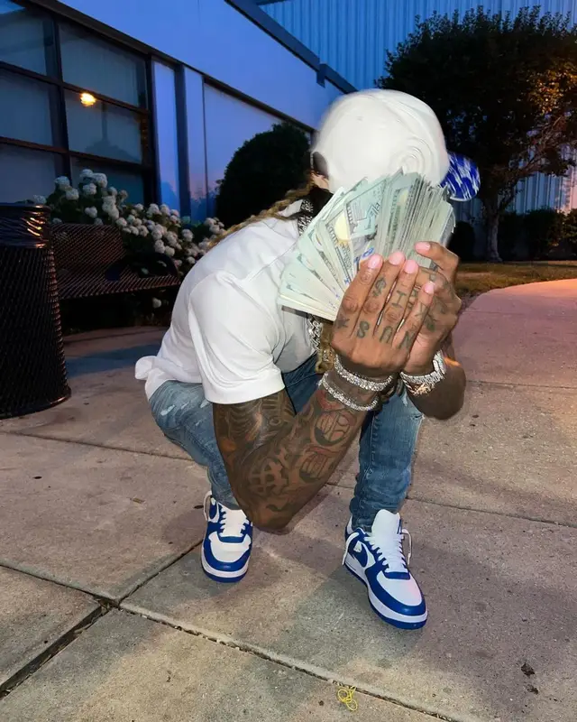 Lil Durk outfit in Amiri, Nike, and Louis Vuitton, 2022