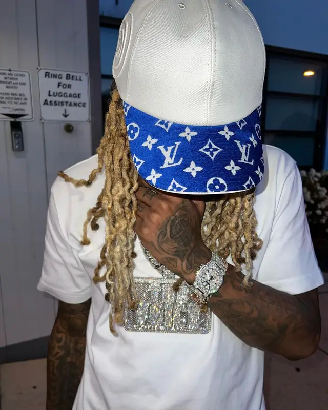 Lil Durk outfit in Amiri, Nike, and Louis Vuitton, 2022