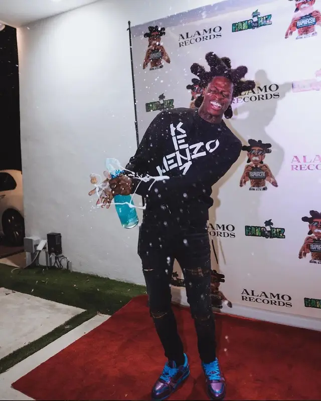 Trapland Pat outfit in Kenzo, Amiri, and Louis Vuitton, 2022
