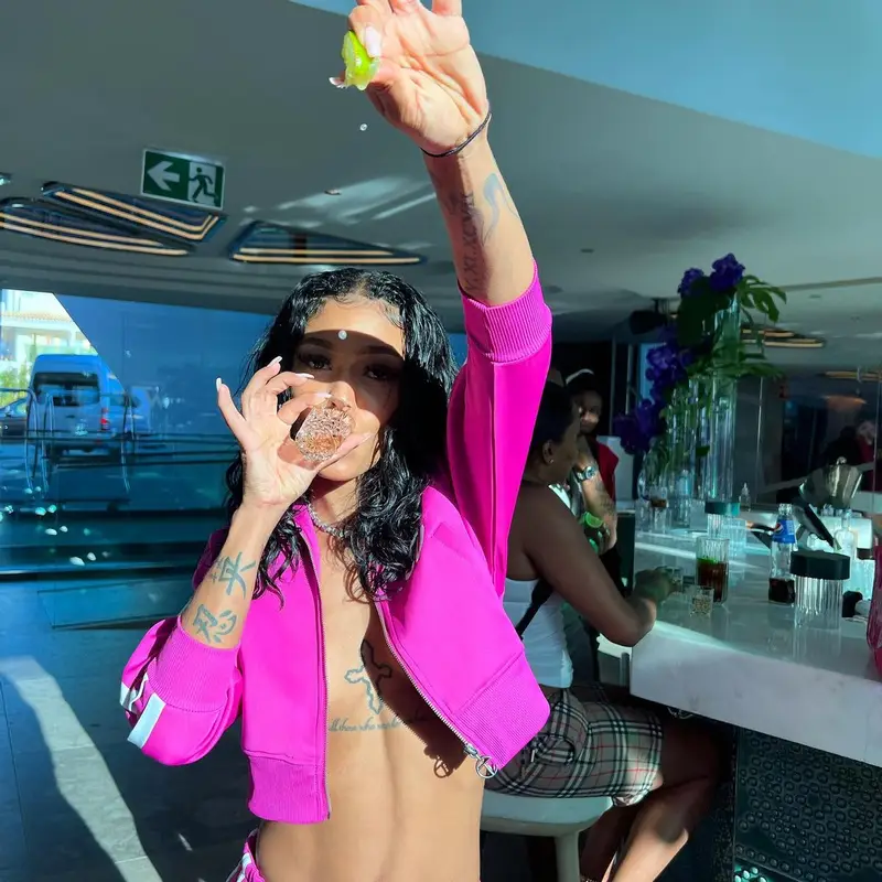 Coi Leray outfit in Telfar and MCM, 2022