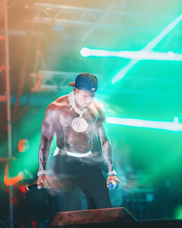 DaBaby outfit in Amiri, Nike, and New Era, 2022