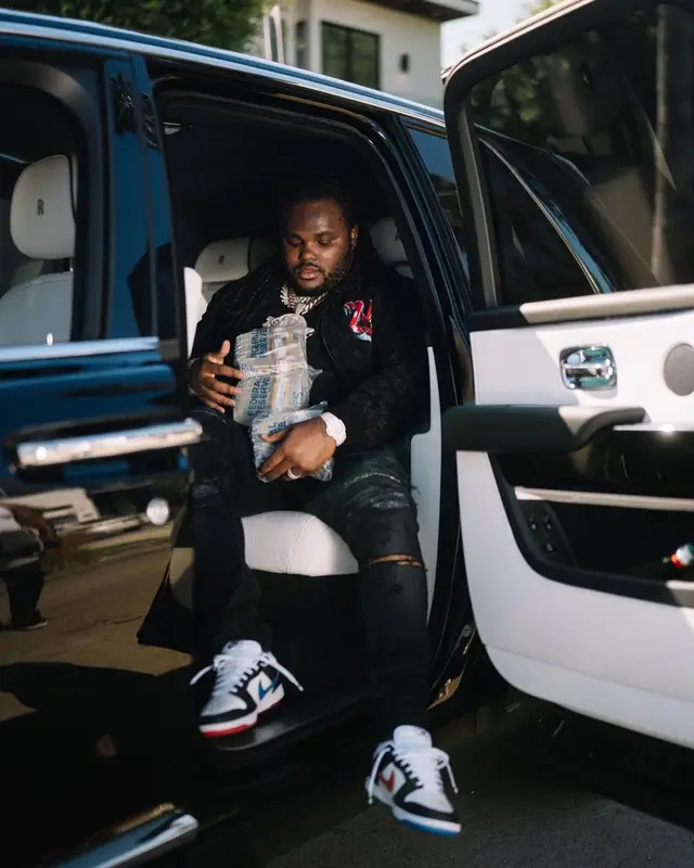 Tee Grizzley outfit in Louis Vuitton, Amiri, and Nike, 2022