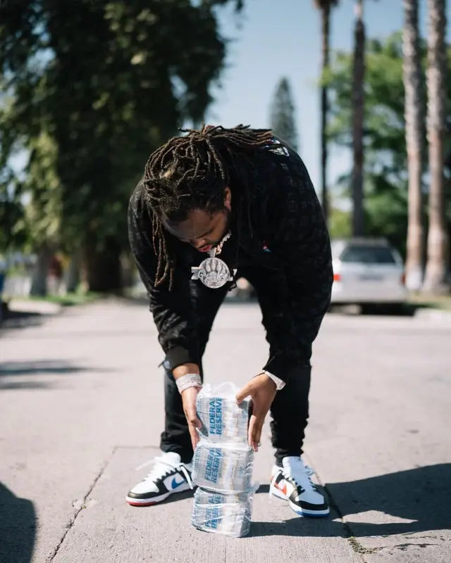 Tee Grizzley outfit in Louis Vuitton, Amiri, and Nike, 2022