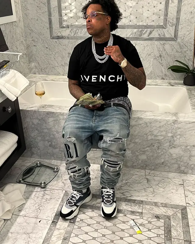 Finesse2tymes outfit in Givenchy, Amiri, and Louis Vuitton, 2022