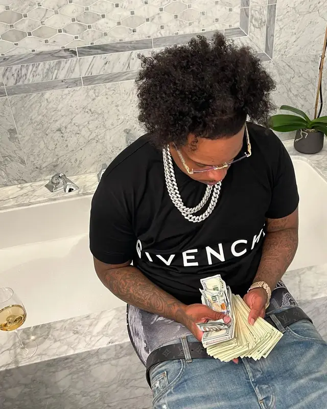 Finesse2tymes outfit in Givenchy, Amiri, and Louis Vuitton, 2022