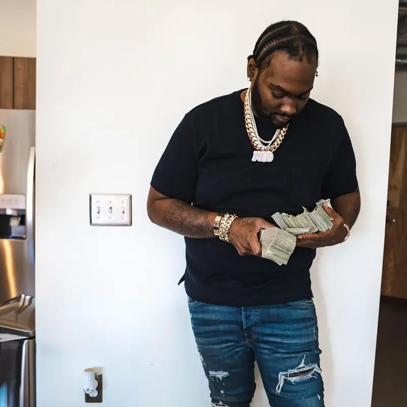 Peezy outfit in Amiri, Louis Vuitton, and Goyard, 2022