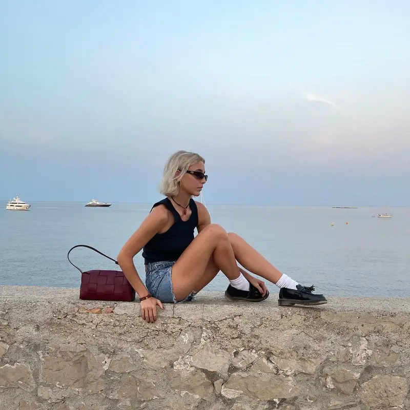 Emma Chamberlain outfit in Brandy Melville, Gucci, and Dr. Martens, 2022