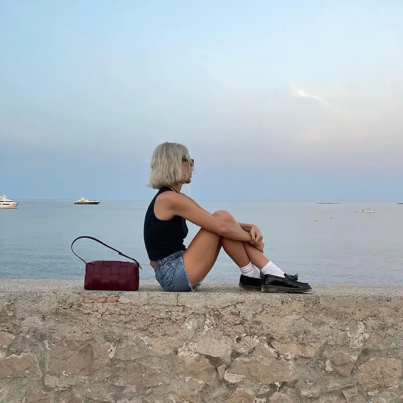 Emma Chamberlain outfit in Brandy Melville, Gucci, and Dr. Martens, 2022