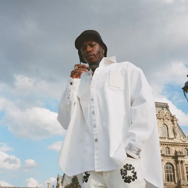 Joey Badass outfit in Raf Simons, Denim Tears, and Kuboraum, 2022