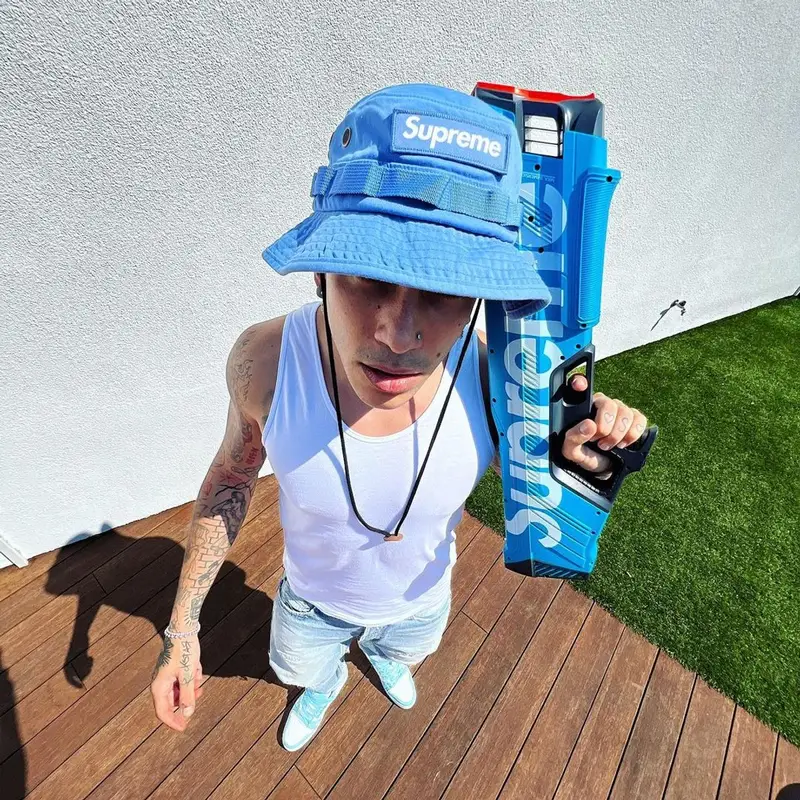 Sfera Ebbasta outfit in Louis Vuitton and Supreme, 2022