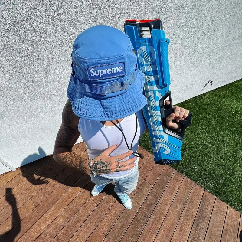 Sfera Ebbasta outfit in Louis Vuitton and Supreme, 2022