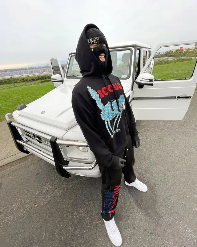 Lil Toe outfit in Gucci, Moncler, and Awake NY, 2022